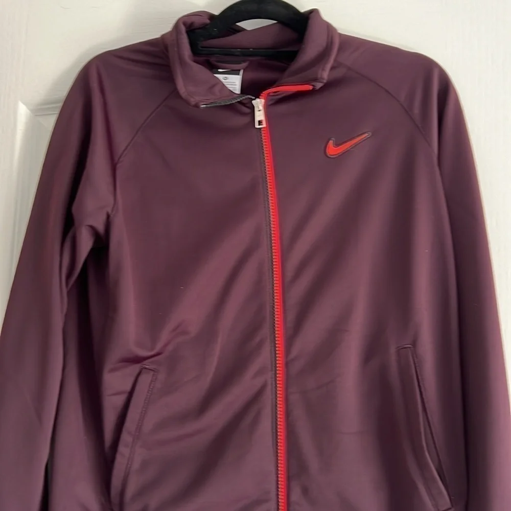 Maroon Nike Jacket size XL Youth black and orange detailing fits womens M/L